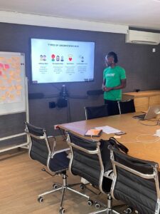 Bisi working with a company to implement practical DEI (Diversity, Equity, and Inclusion) strategies that foster safe workplaces and increase productivity for Black people as well as Queer people.